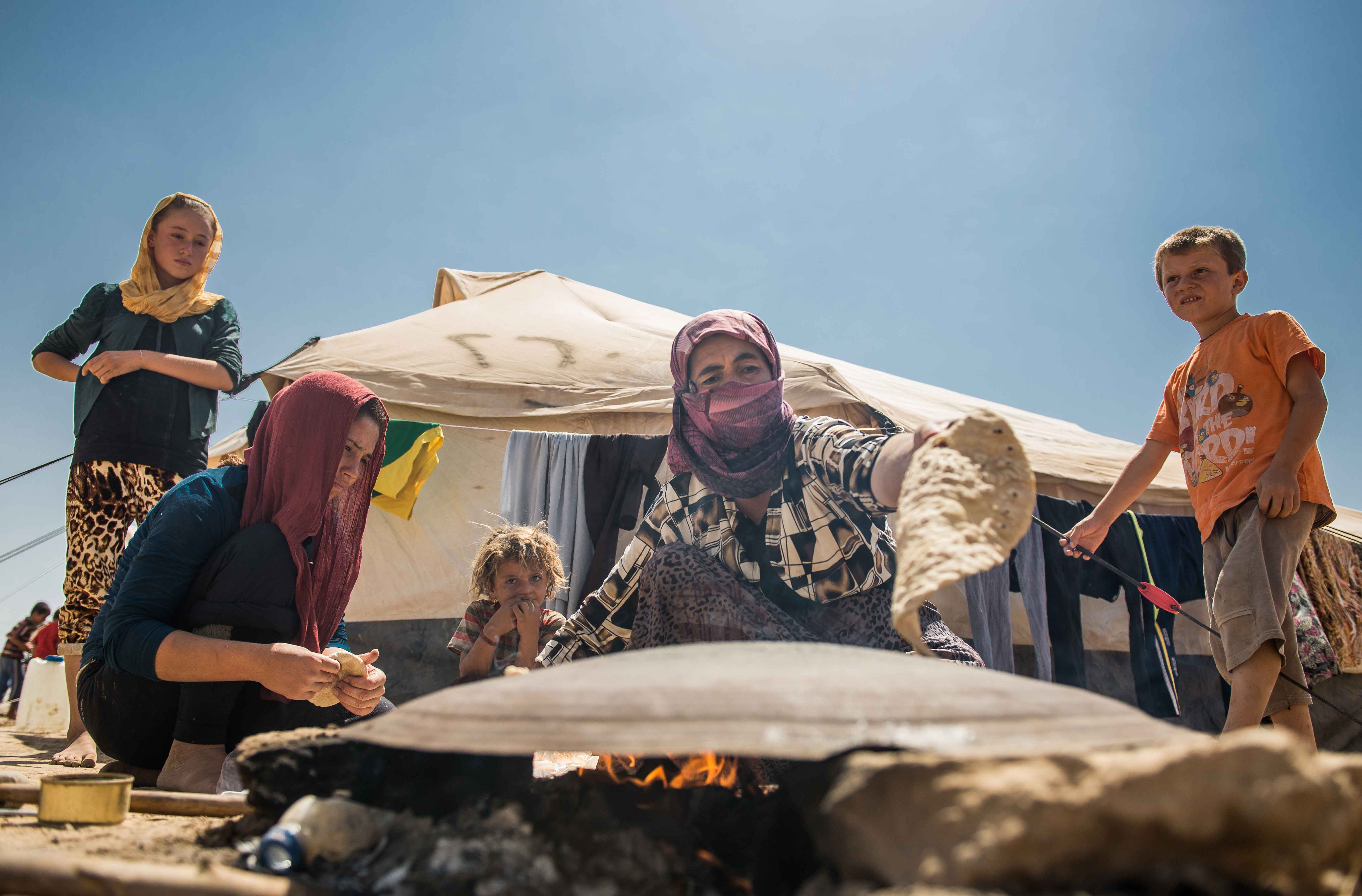 Yazidi-Family-Making-Bread